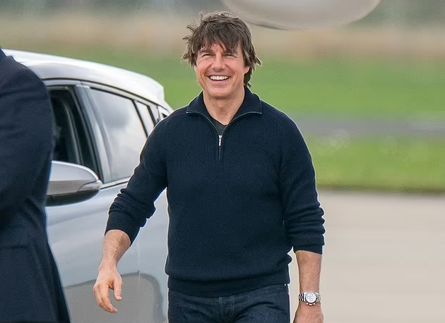 Smiling Tom Cruise makes an unlikely appearance at Teesside Airport as Hollywood icon swaps his helicopter for a private jet