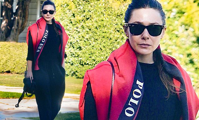 Elizabeth Olsen is casual cool in a red Polo fleece and black sweatpants as she visits a friend in Los Angeles