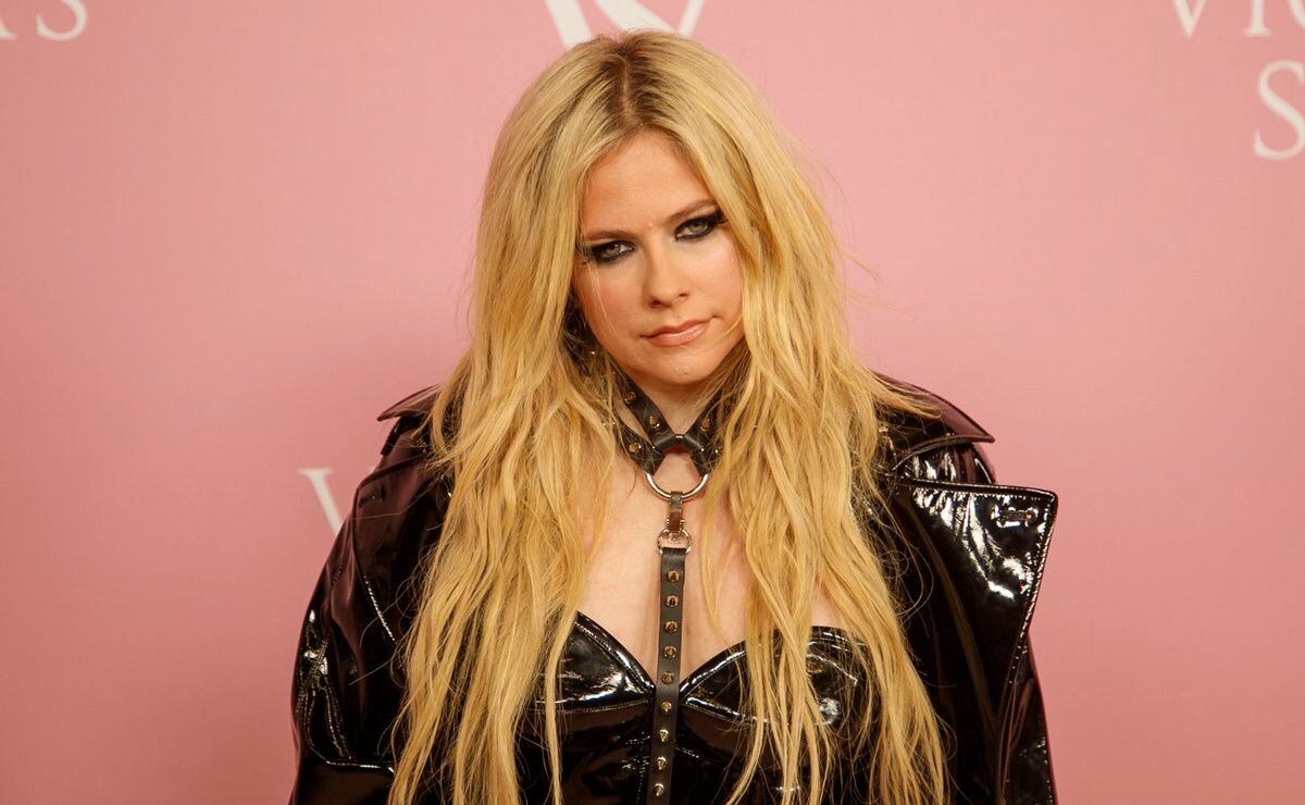 Avril Lavigne looks like a chic dominatrix in a PVC black dress with a dog collar strap at the Victoria's Secret The Tour event in New York City