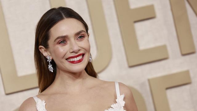 Elizabeth Olsen Goes Ethereal in White Vivienne Westwood Lace Dress at Golden Globes 2024