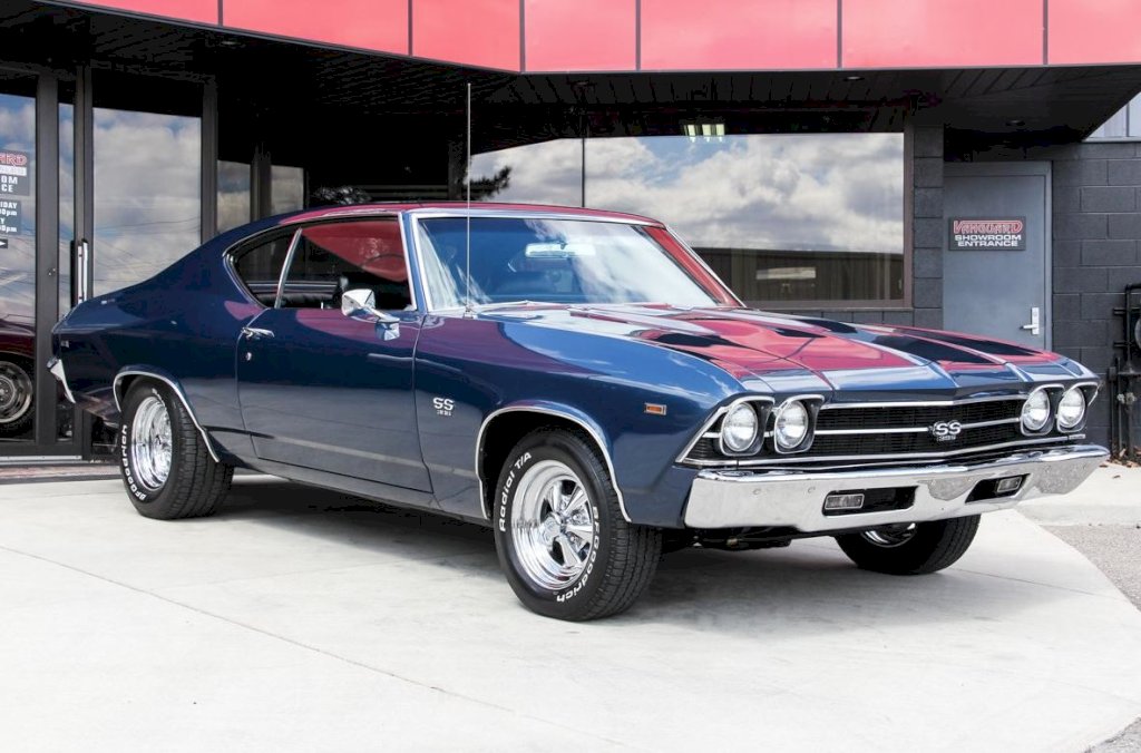 The exterior of the 1969 Chevrolet Chevelle SS 396 was characterized by its long, sleek lines and distinctive Coke bottle shape, with the front and rear fenders bulging outwards to accommodate the wide tires needed for traction. 