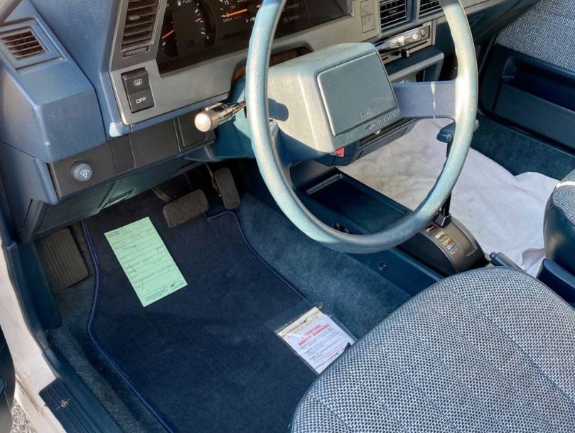 The interior design of the 1987 Nova was straightforward and uncluttered, with easy-to-read gauges and clearly labeled controls. 